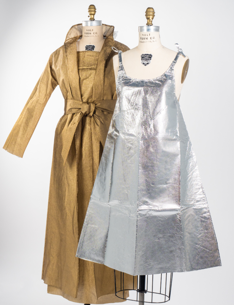 (Left to right) Jewel Tea Company, coat, dress and belt, 1966. Lustre-Weave 100% non-woven polyethylene. Collection of Phoenix Art Museum, gift of Cathy Beardsley; Unknown, dress, 1960s. 90% rayon and 5% metalized polyester. Collection of Phoenix Art Museum, promised gift of Kelly Ellman. Image © Phoenix Art Museum. 