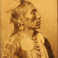 Edward S. Curtis, ‘Medicine Crow,’ 1909, goldtone. Peterson Family Collection.