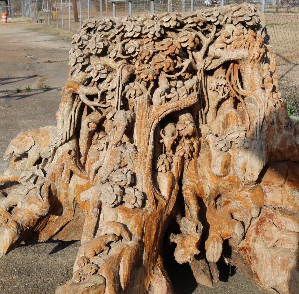 Teakwood tree trunk carved with animals, birds and flowers, est. $5,000-$30,000