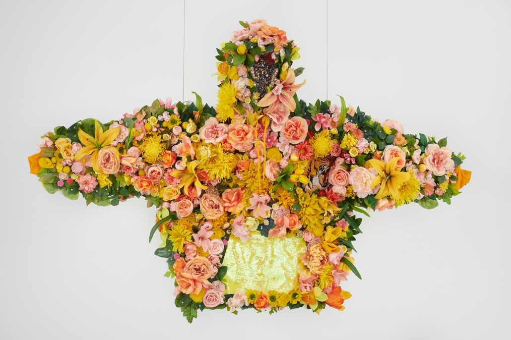 Devan Shimoyama, ‘February II,’ 2019. Silk flowers, rhinestones, jewelry, sequins, and embroidered patch on cotton hoodie with steel armature, coated wire and fishing line, 45in by 72in by 12in. (114.3cm by 182.9cm by 30.5cm). Courtesy Private Collection and De Buck Gallery, New York. Photo credit: Phoebe dHeurle