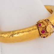 Etruscan style 22K yellow gold and ruby bangle bracelet, est. $3,000-$5,000