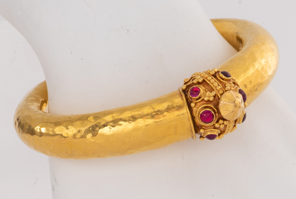 Etruscan style 22K yellow gold and ruby bangle bracelet, est. $3,000-$5,000