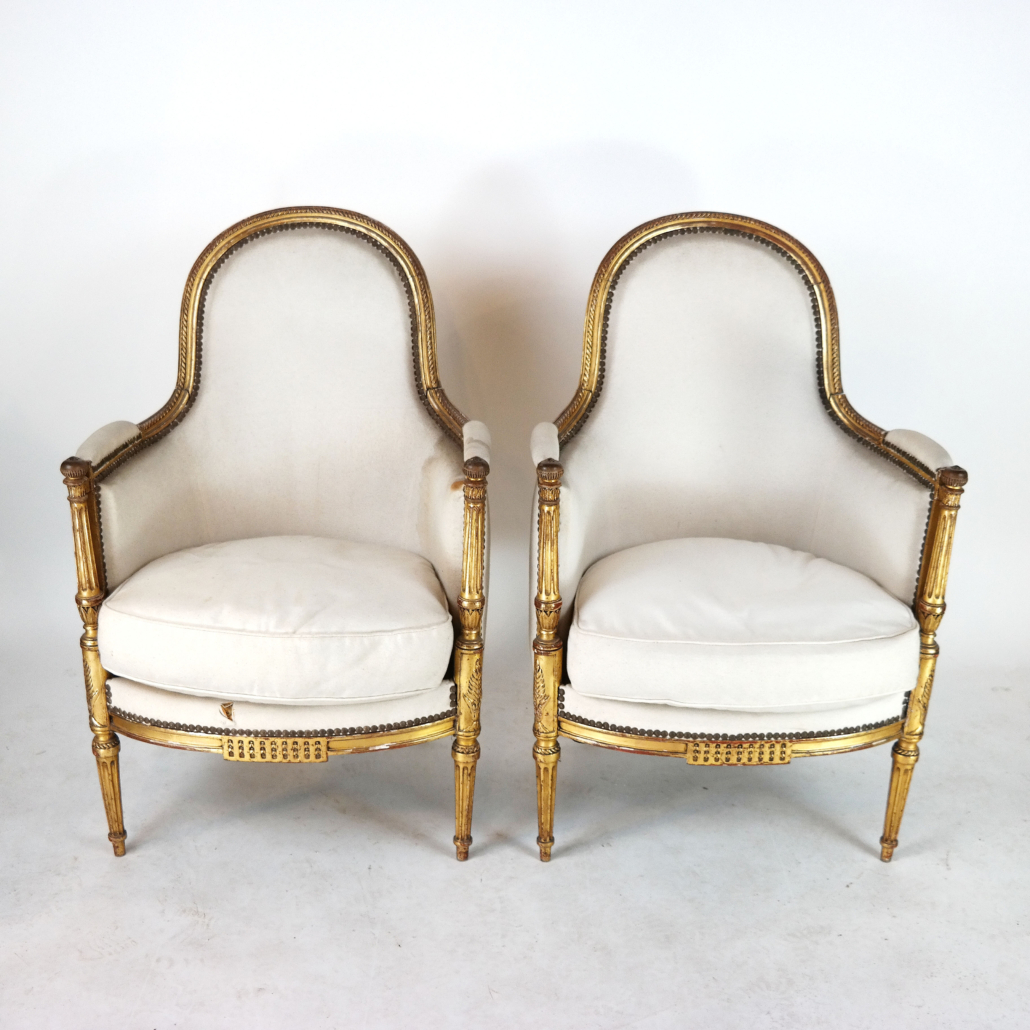 Pair of Louis XVI-style carved and gilt walnut bergeres, est. $3,000-$4,000