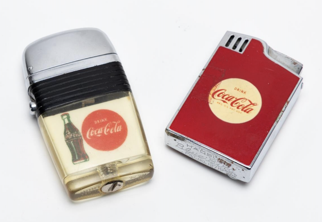 Two of Robert Woodruff’s personal Coca-Cola-branded lighters, est. $150-$300
