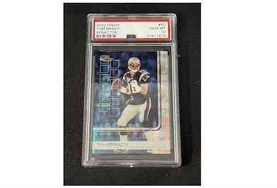 A 2002 Topps Finest X-Fractor card featuring Tom Brady, one of only 20 made, sold for $118,000 at auction on January 31. Image courtesy of Saco River Auction and LiveAuctioneers