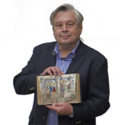 Stephen Turner holds a Book of Hours offered in a January 2022 auction that realized $14,000 plus the buyer’s premium. Image courtesy of Turner Auctions + Appraisals.
