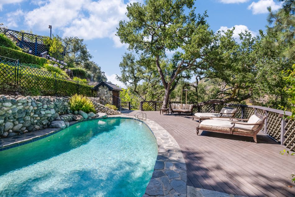 A terraced path at Brooke Shields’s recently sold Pacific Palisades home leads to the waterfall pool and spa. Courtesy of TopTenRealEstateDeals.com, Photo Credit: Adrian Van Anz