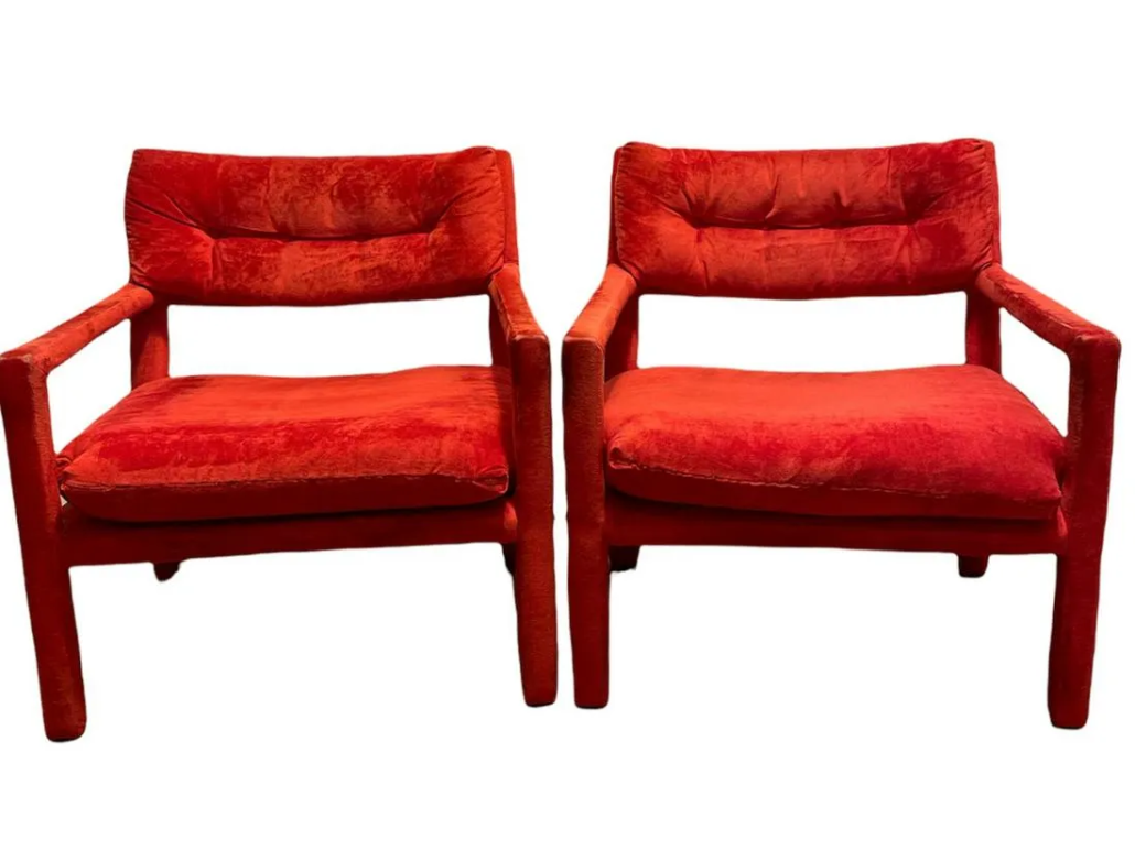Pair of Milo Baughman-style red armchairs. Estimate $200-$400