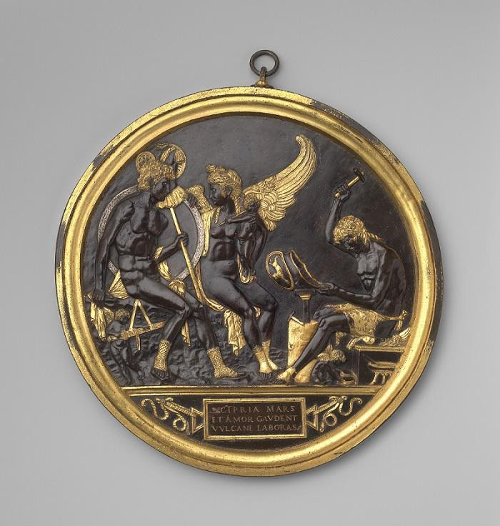 Attributed to Gian Marco Cavalli (Italian, ca. 1454–after 1508, activity documented 1475–1508). ‘Mars, Venus and Cupid with Vulcan at his Forge (The Mantuan Roundel),’ ca. 1500. Parcel-gilt bronze with silver inlay. Integrally cast gilt frame with suspension loop. Diameter: 16 9/16in (42cm); Depth: 11/16in (1.7cm); Height with suspension loop: 18 3/8in (46.7cm). The Metropolitan Museum of Art, Purchase, The Isaacson-Draper Fund, Florence and Herbert Irving Acquisitions Fund, 2021 Benefit Fund, Louis V. Bell, Harris Brisbane Dick, Fletcher, and Rogers Funds and Joseph Pulitzer Bequest, Walter and Leonore Annenberg Acquisitions Endowment Fund, Alejandro Santo Domingo, Michel David-Weill, David T. Schiff, Annette de la Renta, Mark Fisch, the Hon. Kimba Wood and Frank Richardson, Denise and Andrew Saul, Beatrice Stern, Wrightsman Fellows, and members of the Acquisitions Committee Gifts, 2022 (2022.6)