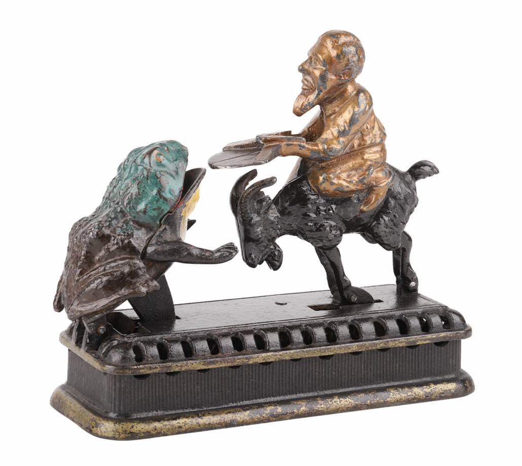 Mechanical Novelty Works painted cast iron second degree mechanical bank with a goat and frog mechanism, est. CA$2,000-$3,500