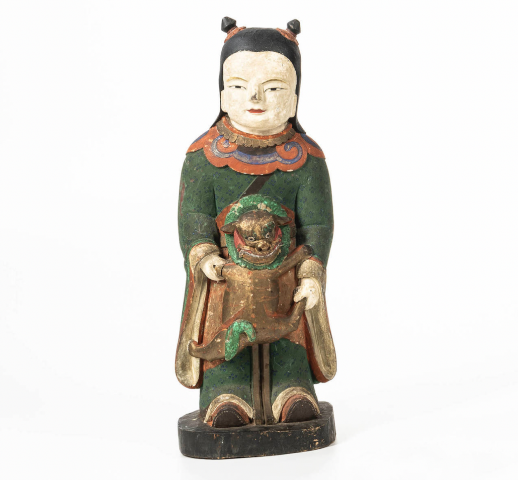 Korean Buddhist wood figure of dongja, est. $12,000-$20,000. Image courtesy of Skinner