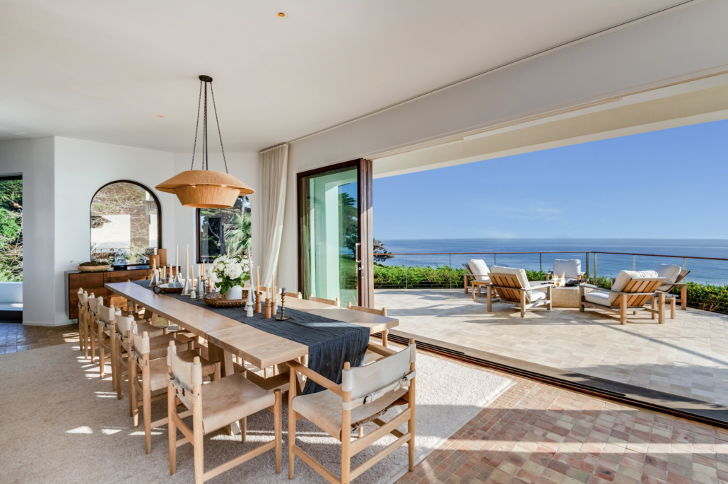The blurring of indoor and outdoor spaces at the Malibu home is enhanced by expanses of sliding glass. Image courtesy of TopTenRealEstateDeals.com. Photo credit: Courtesy of Coldwell Banker Realty