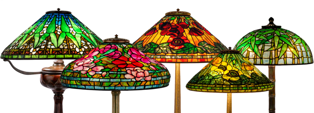 Selection of Tiffany Studios lamps in the sale, estimates varied