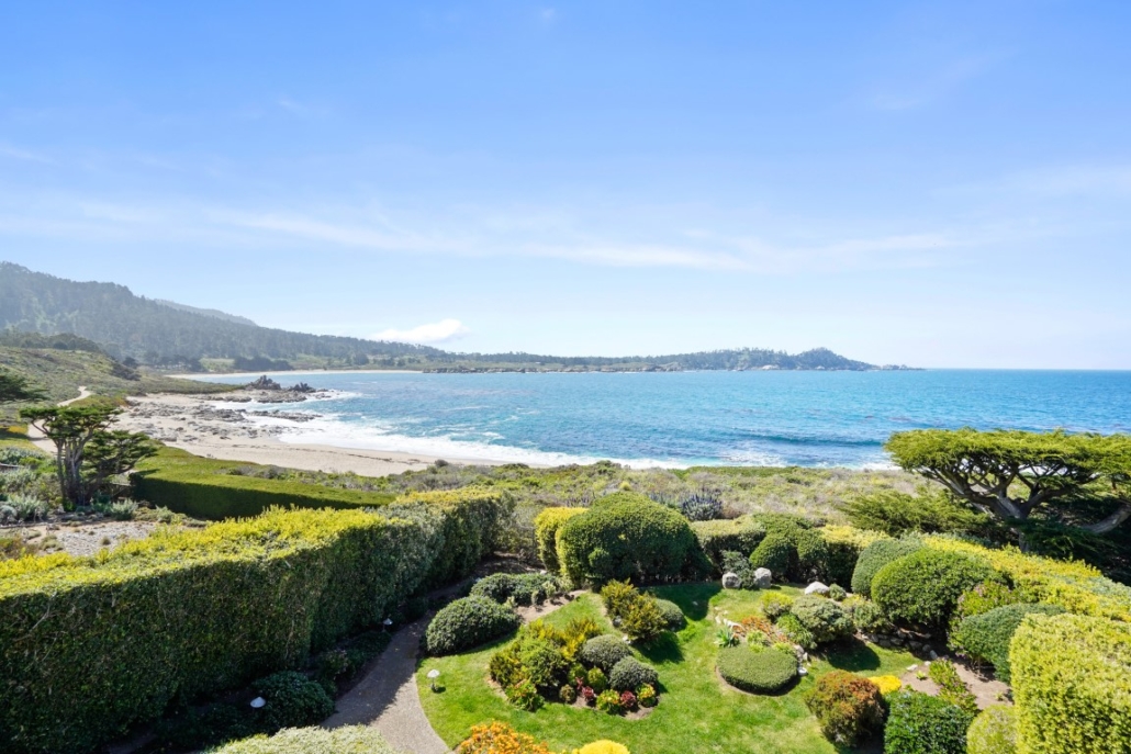 The Carmel-by-the-Sea home’s flower garden is protected from ocean breezes with strategically-placed shrubs and trees. Courtesy of Sotheby’s International Realty and TopTenRealEstateDeals.com
