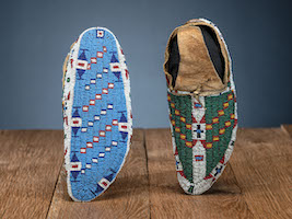 Sioux fully beaded buffalo hide moccasins, $40,625