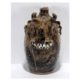 This Marie Rogers devil face jug, featuring a Bible verse, realized $900 plus the buyer’s premium in November 2013. Image courtesy of Slotin Folk Art and LiveAuctioneers.