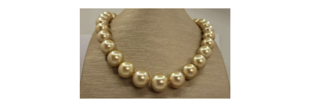 18K gold necklace of large, gold-hued South Sea pearls, est. $18,000-$20,000