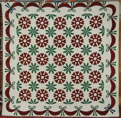 19th-century early Heart Wreath applique quilt, est. $2,500-$3,000