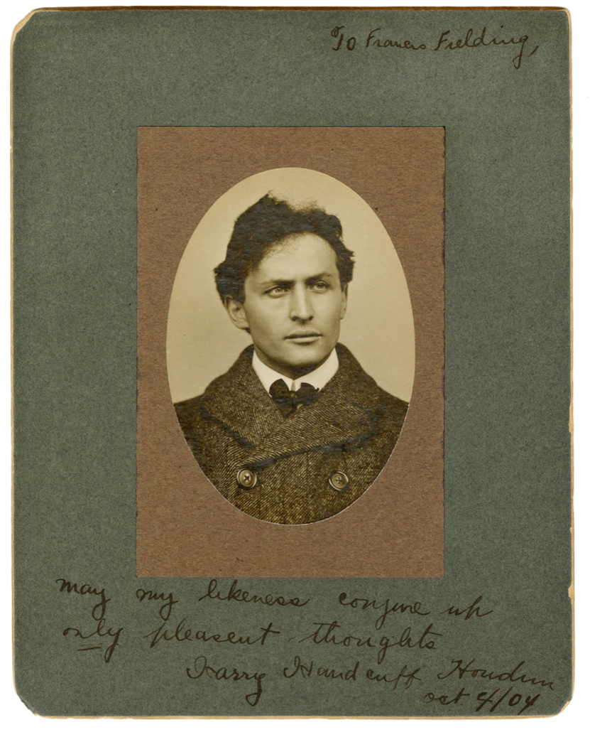 Silver print oval bust portrait of Harry Houdini, inscribed and signed by the magician, est. $2,500-$5,000