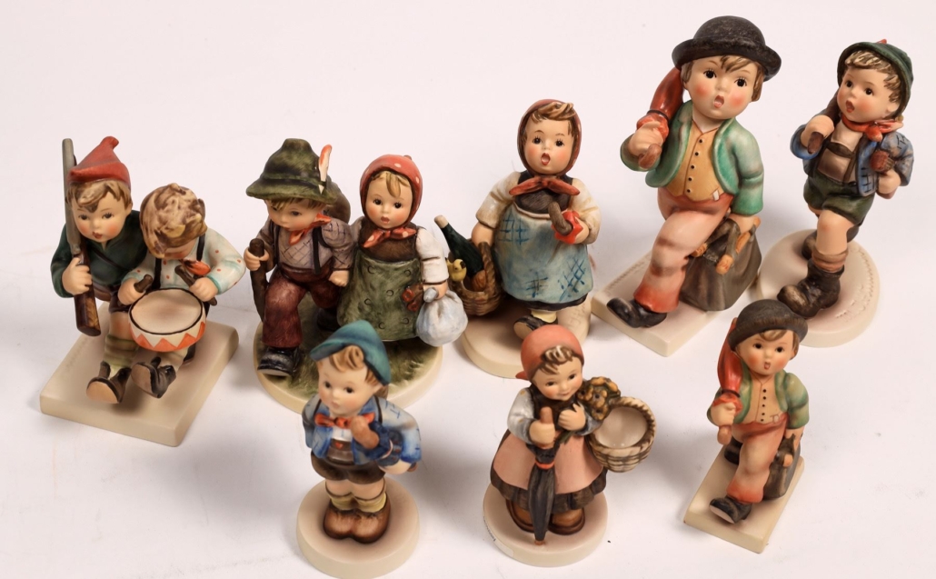 Group of nine travel-themed Hummel figurines, est. $120-$200