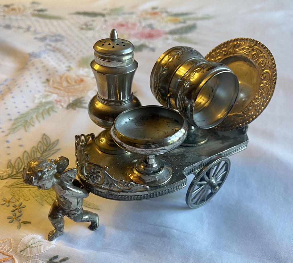This very ornate napkin ring from Linda Tarasuk’s collection is also fitted with a salt and pepper shaker as well as a container for a butter pat. The functioning wheels move the cart, adding to its value. Image courtesy of Linda Tarasuk.