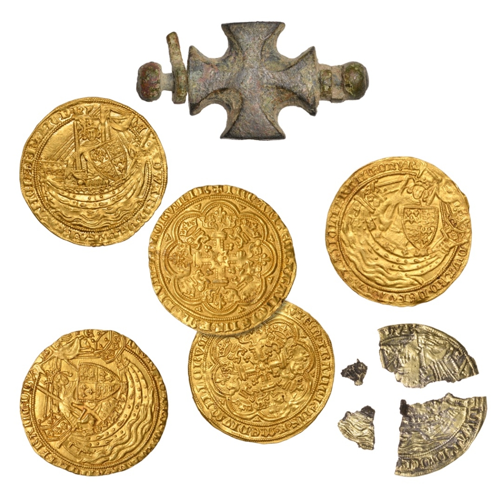 The purse hoard discovered by the Castles in 2018 contained five genuine 14th-century gold coins, which pictured King Edward III; a broken forged coin; and the purse’s metal bar. Image courtesy of Noonans