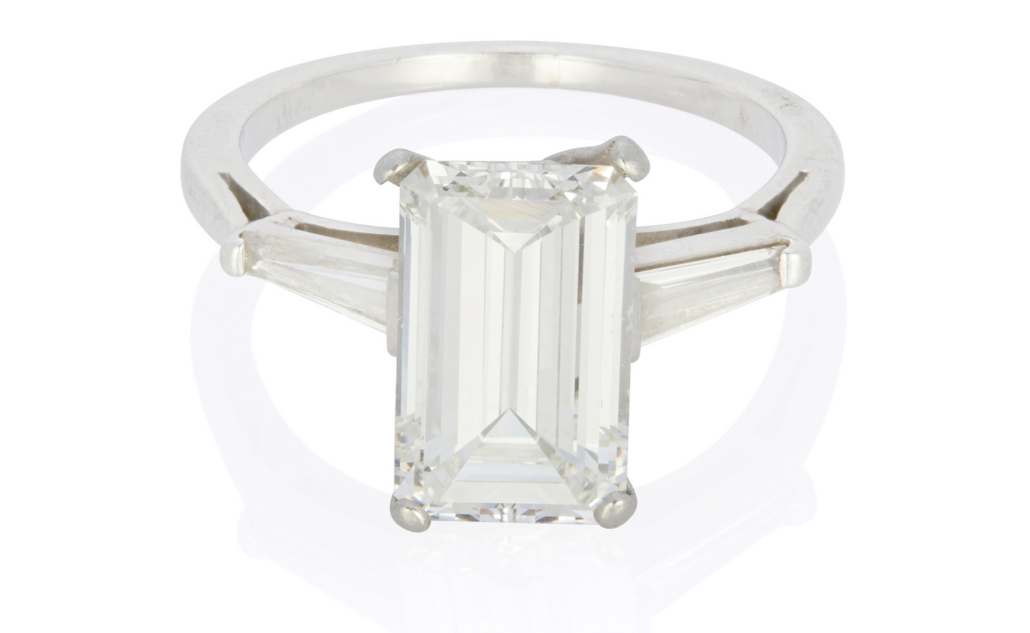 Emerald-cut diamond and platinum ring, $23,750