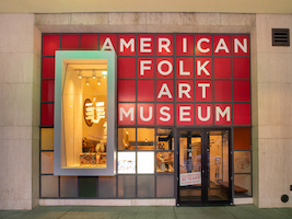 Entrance to the American Folk Art Museum in New York, photographed in June 2019. It recently announced it had accepted a $5 million donation from Becky and Bob Alexander, who will receive naming rights to the museum CEO’s job title in recognition of the gift. Image courtesy of Wikimedia Commons, photo credit Ajay Suresh. It was originally posted to Flickr and is shared under the Creative Commons Attribution 2.0 Generic license.
