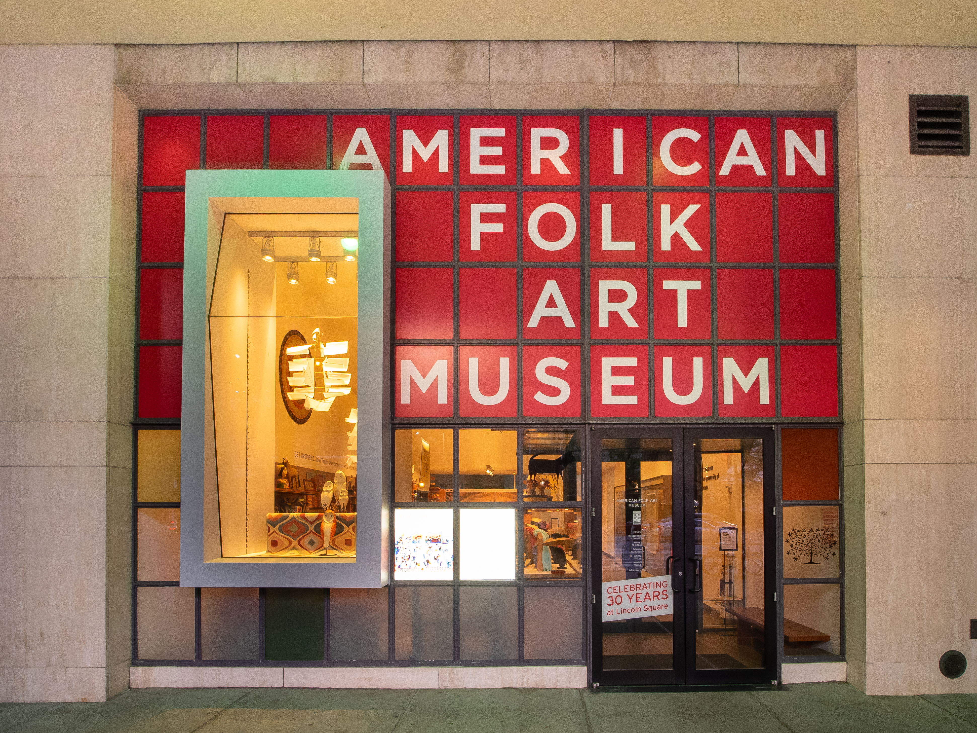 Entrance to the Americna Folk Art Museum in New York, photographed in June 2019. It recently announced it had accepted a $5 million donation from Becky and Bob Alexander, who will receive naming rights to the museum CEO’s job title in recognition of the gift. Image courtesy of Wikimedia Commons, photo credit Ajay Suresh. It was originally posted to Flickr and is shared under the Creative Commons Attribution 2.0 Generic license.