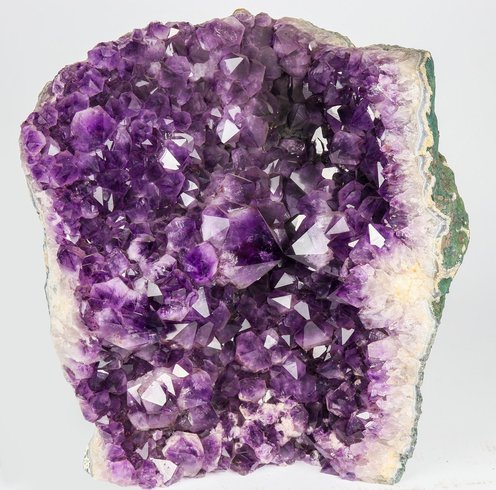 Large amethyst cavern geode with deep purple crystals, $1,375