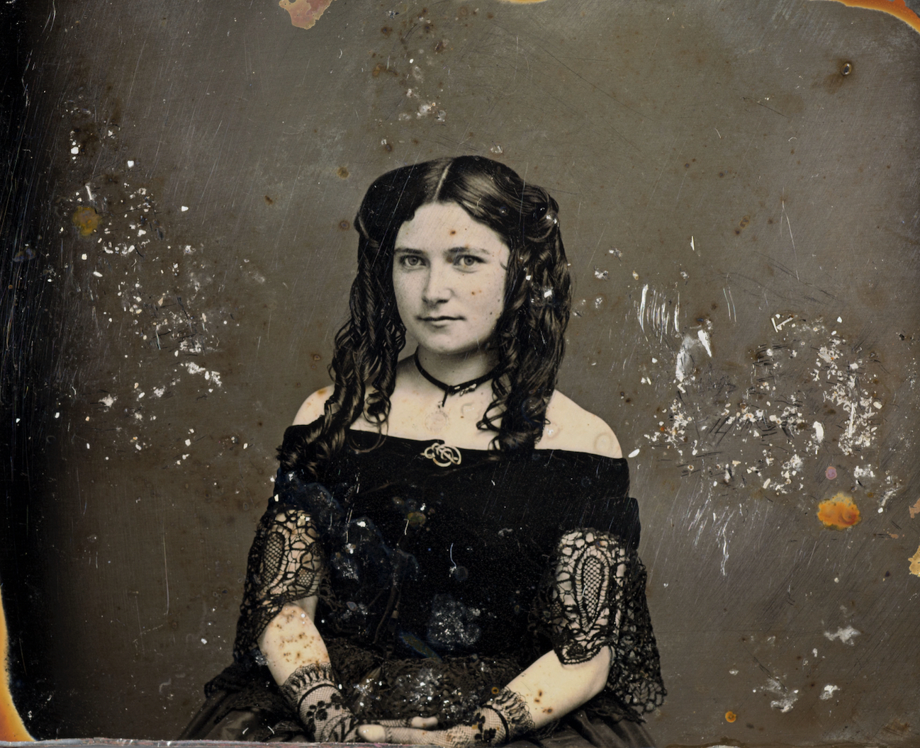 One of the notable artifacts recovered from the wreck of the S.S. Central America is this 19th-century daguerreotype metal plate photograph of an unidentified young woman that the scientific mission recovery team nicknamed the Mona Lisa of the Deep. Photo credit: Holabird Western Americana Collections.