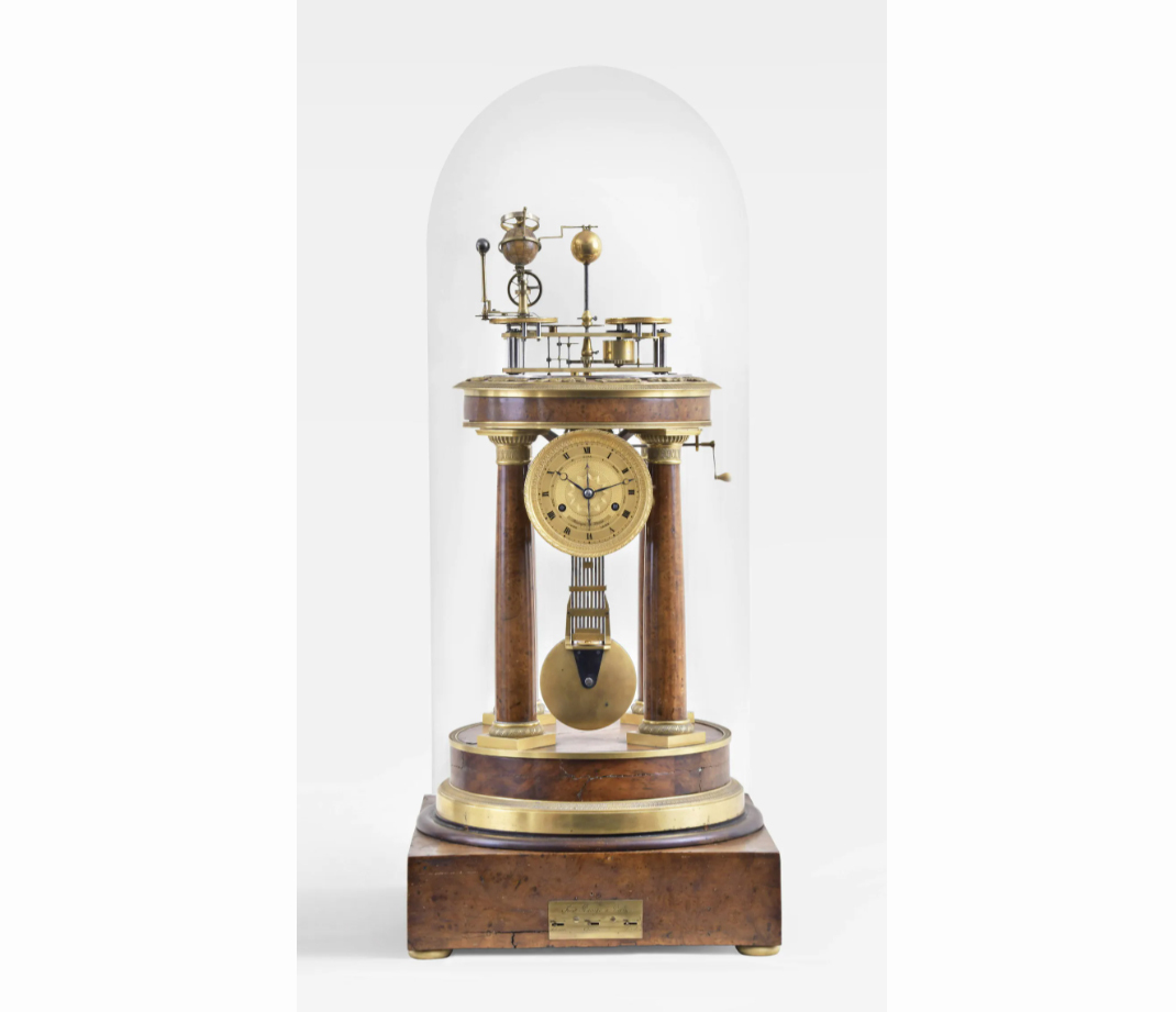 An amboyna and gilt bronze orrery clock with a music box signed by Raingo Freres brought $150,000 plus the buyer’s premium in June 2022. Image courtesy of Schmitt Horan & Co. and LiveAuctioneers.