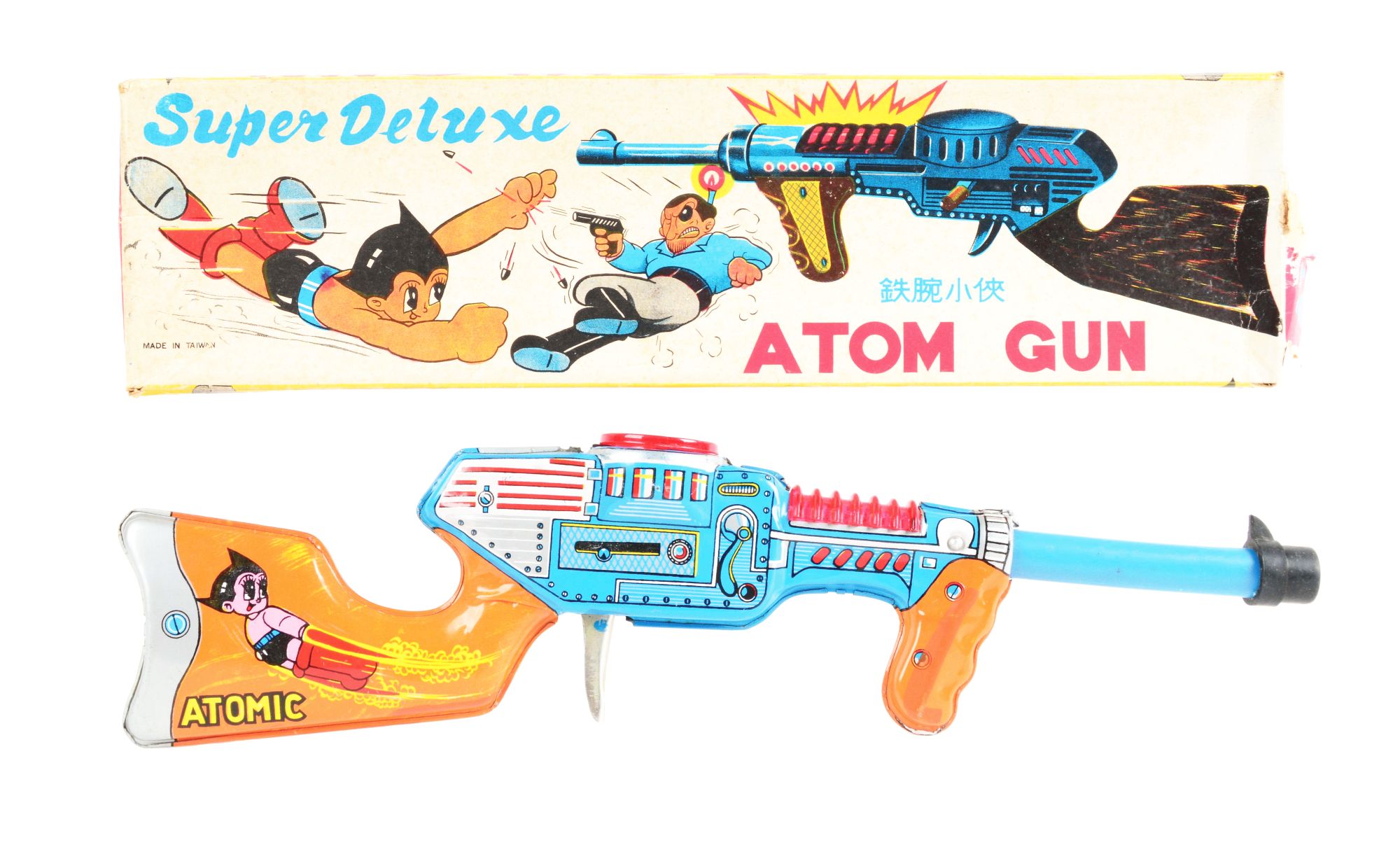 Super Deluxe Atom Gun with graphics of flying Atom Boy on both sides of toy and its accompanying original box. Made in Taiwan. Excellent condition. Estimate $1,000-$1,500