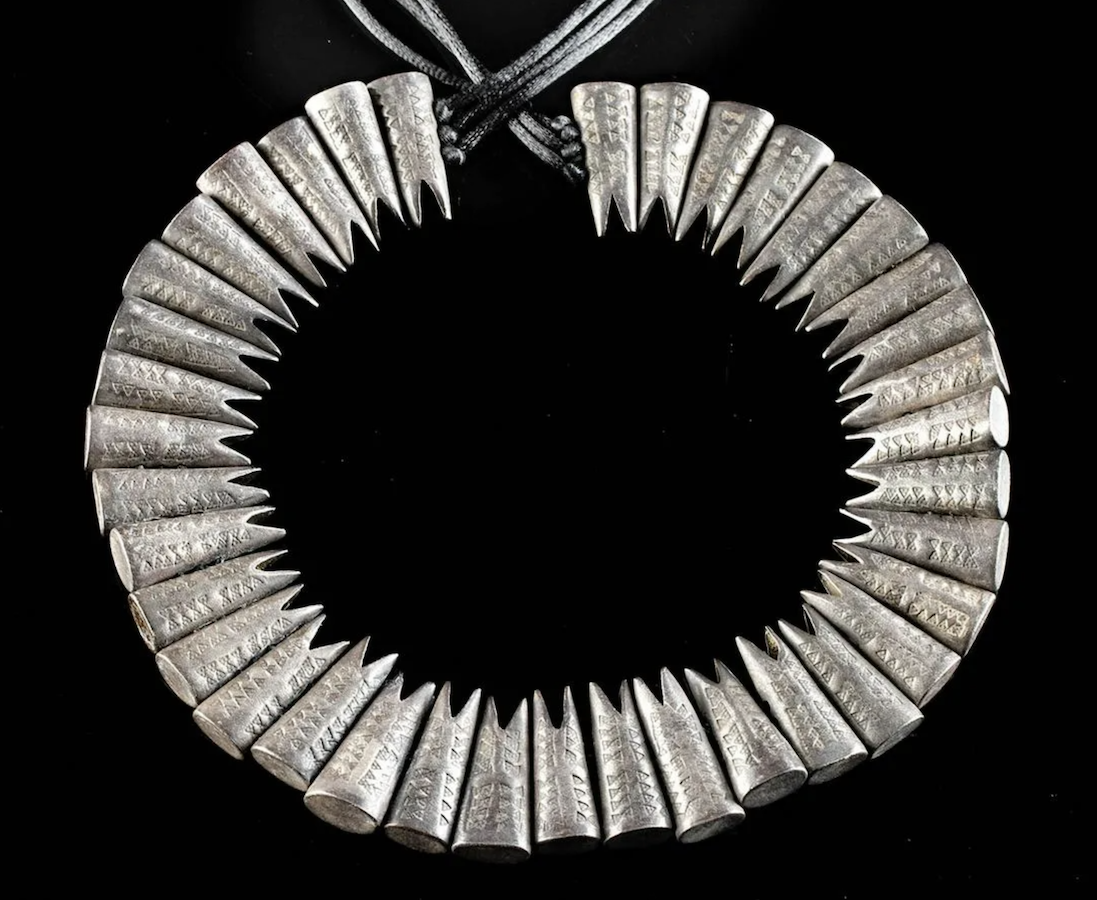 Circa-10th-century CE Viking/Scandinavian/Norse necklace with 38 hollow fishtail pendants crafted from nearly pure (98.98%) silver, total weight 187.5g. The obverse side of each pendant is stamped with three stippled dots in characteristic Viking fashion. Provenance: New York, Koenigsberg and Latvia private collections; found on the Baltic Sea coast prior to 1982. Searched through Art Loss Register database and cleared. Est. $50,000-$75,000. Courtesy of Artemis Gallery
