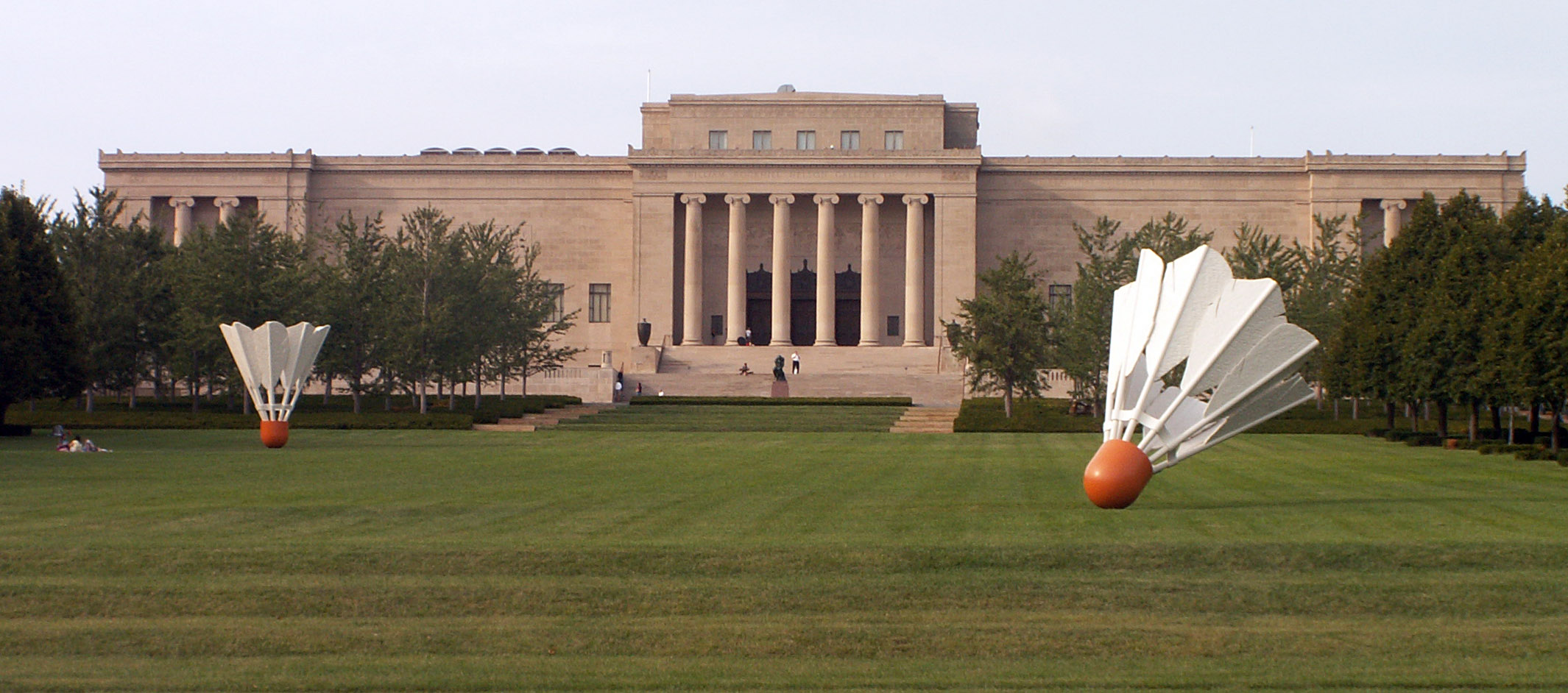 September 2007 image of ‘Shuttlecocks,’ a sculpture by Claes Oldenburg and Coosje van Bruggen, outside the Nelson-Atkins Museum of Art. The work became so connected with the Kansas City, Missouri museum that it ultimately adopted it as its logo. Image courtesy of Wikimedia Commons, photo credit Americasroof. Shared under the Creative Commons Attribution-Share Alike 3.0 Unported license.