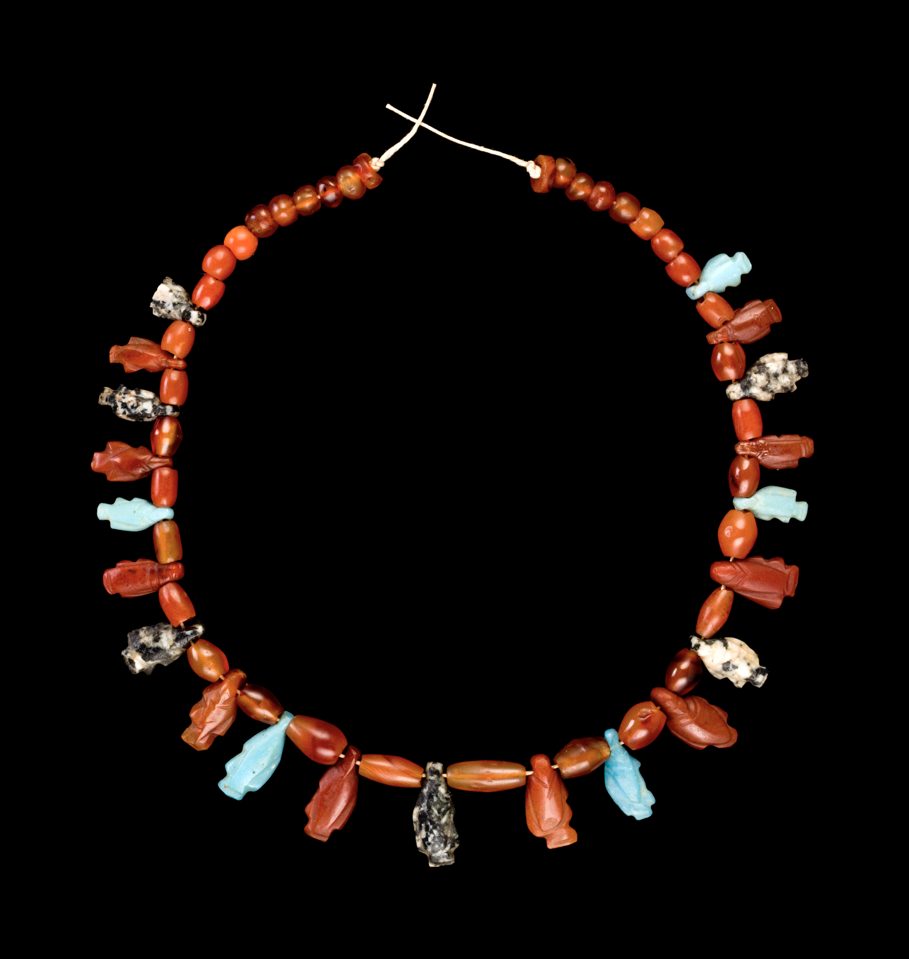 Necklace with fish pendants, ancient Egyptian, New Kingdom, about 1539–1077 B.C., carnelian, various hardstones, and glass frit. Mrs. Kingsmill Marrs Collection, Worcester Art Museum, 2001.119 