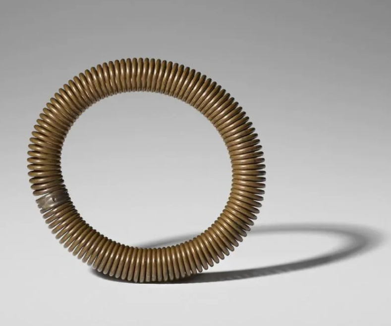 A circa-1975 Harry Bertoia bronze spiral-coiled bracelet realized $5,000 plus the buyer’s premium in May 2017. Image courtesy of Wright and LiveAuctioneers.