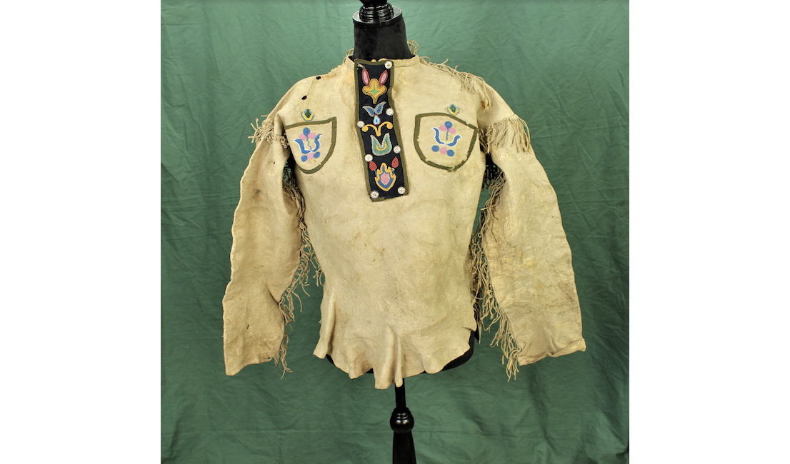 Circa 1860-1870 Native American fringed buckskin frontier shirt with attractively beaded pockets and yoke. Estimate $2,000-$4,000