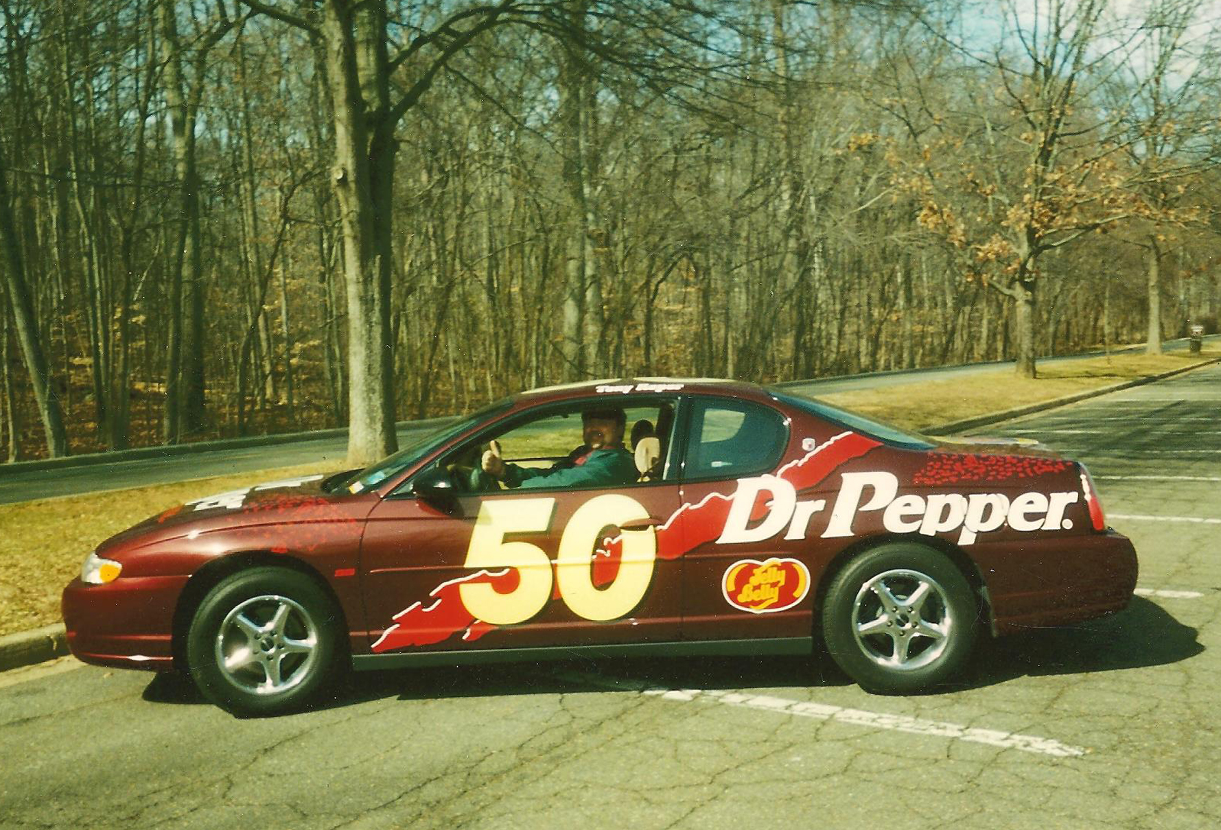 In this undated photo, collector Greg Powers sits behind the wheel of his replica Dr Pepper NASCAR car, which he has since sold. Image courtesy of Greg Powers.