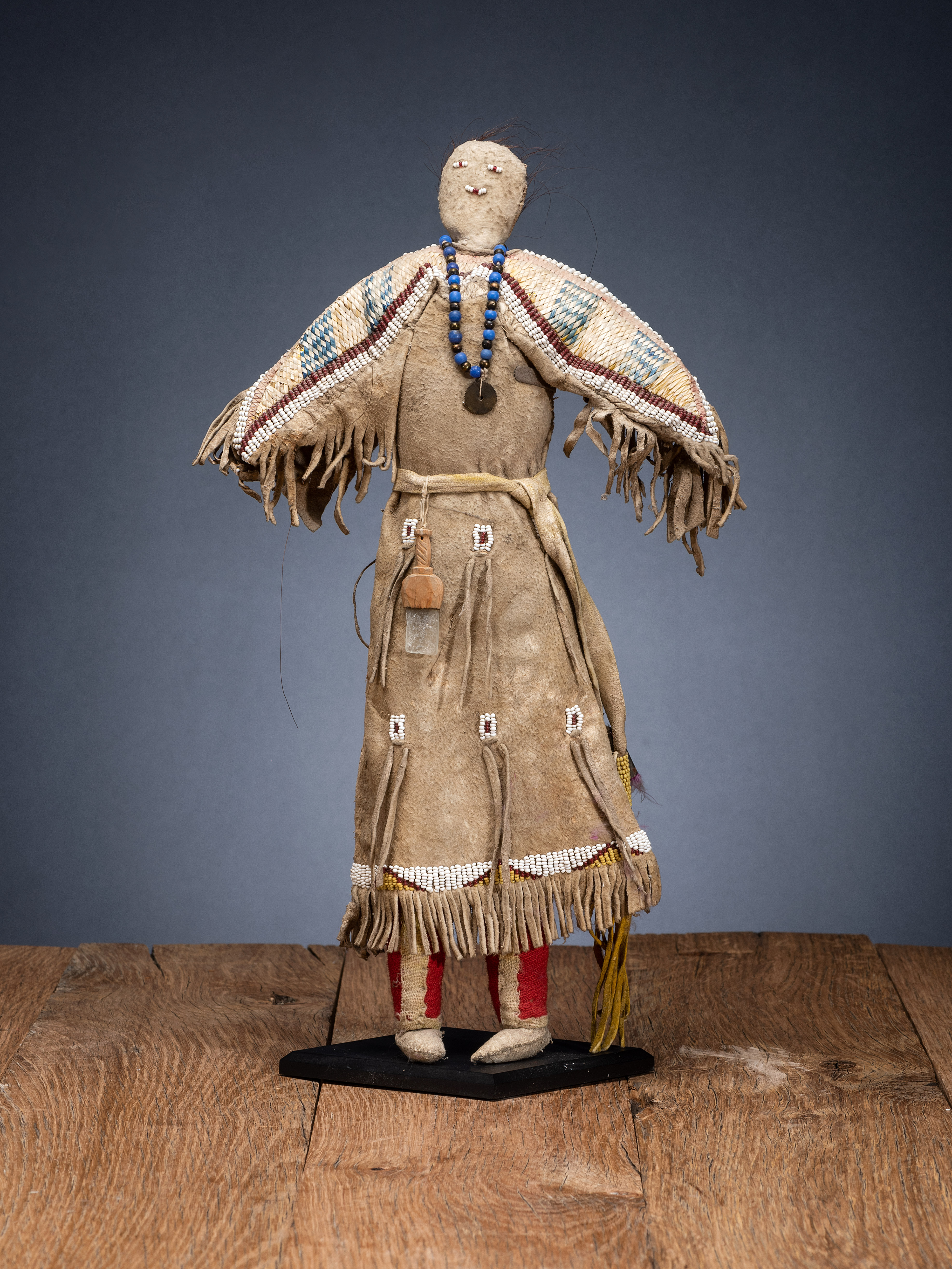 Hidatsa doll with beaded and quilled dress, est. $8,000-$10,000