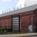 Exterior of the Massachusetts Museum of Contemporary Art, aka MASS MoCA, photographed in April 2012. Unionized workers at the North Adams, Mass., museum have announced a one-day strike to take place on Friday, August 19. Image courtesy of WikiMedia Commons, photo credit Beyond My Ken. Shared under a series of Creative Commons licenses, most recently the Creative Commons Attribution-Share Alike 4.0 International license.