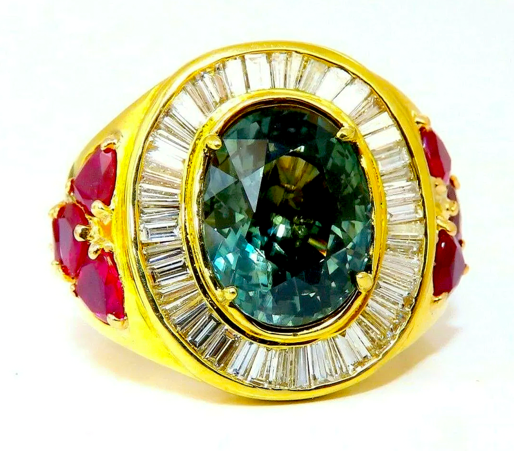  18K gold ring centered on a GIA-certified 7.71-carat natural blue-green sapphire, est. $44,000-$53,000