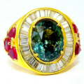 18K gold ring centered on a GIA-certified 7.71-carat natural blue-green sapphire, est. $44,000-$53,000