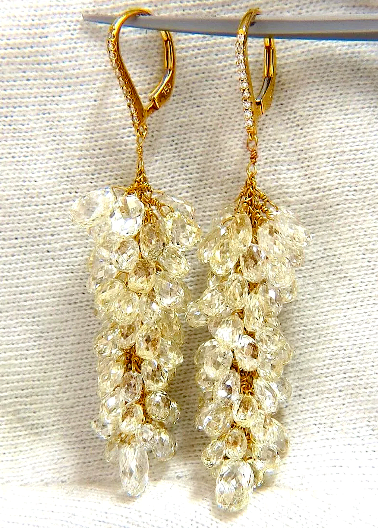 Pair of floating grapevine-style dangle earrings set with 50 carats’ worth of diamonds, est. $36,000-$43,000
