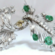 Platinum estate pin with diamonds and six carats of Columbian emeralds, est. $12,000-$14,000