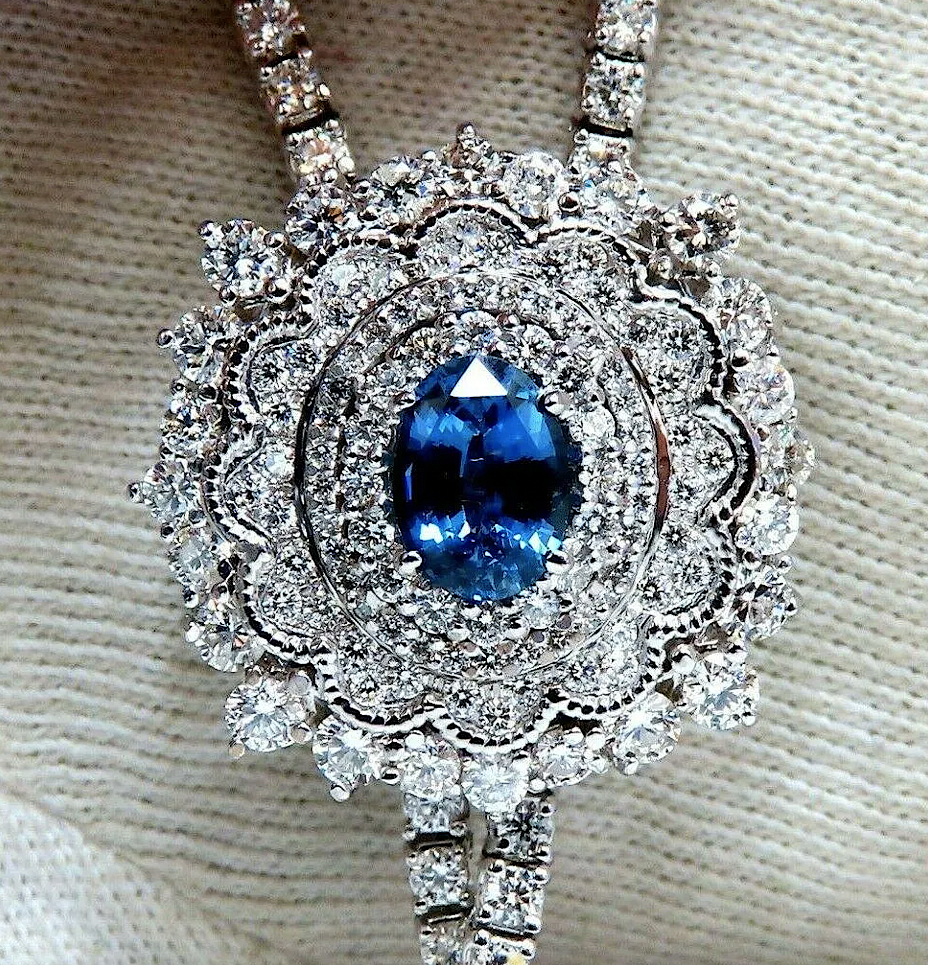 18K white gold, diamond and sapphire bolo cluster necklace, est. $32,000-$38,000