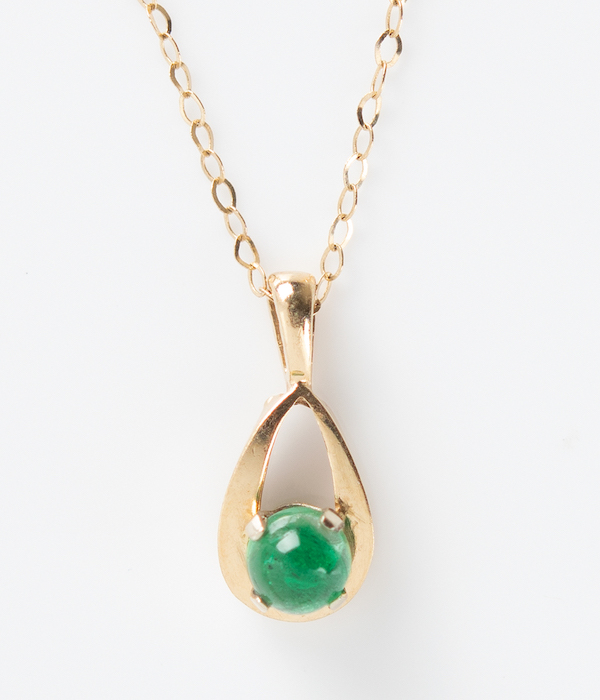 14K gold and emerald necklace given by Elon Musk to his college girlfriend, Jennifer Gwynne, in 1994, offered with two photographs, $51,008