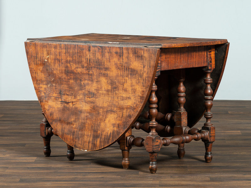 William and Mary figured maple drop leaf dining table, est. $3,000-$5,000
