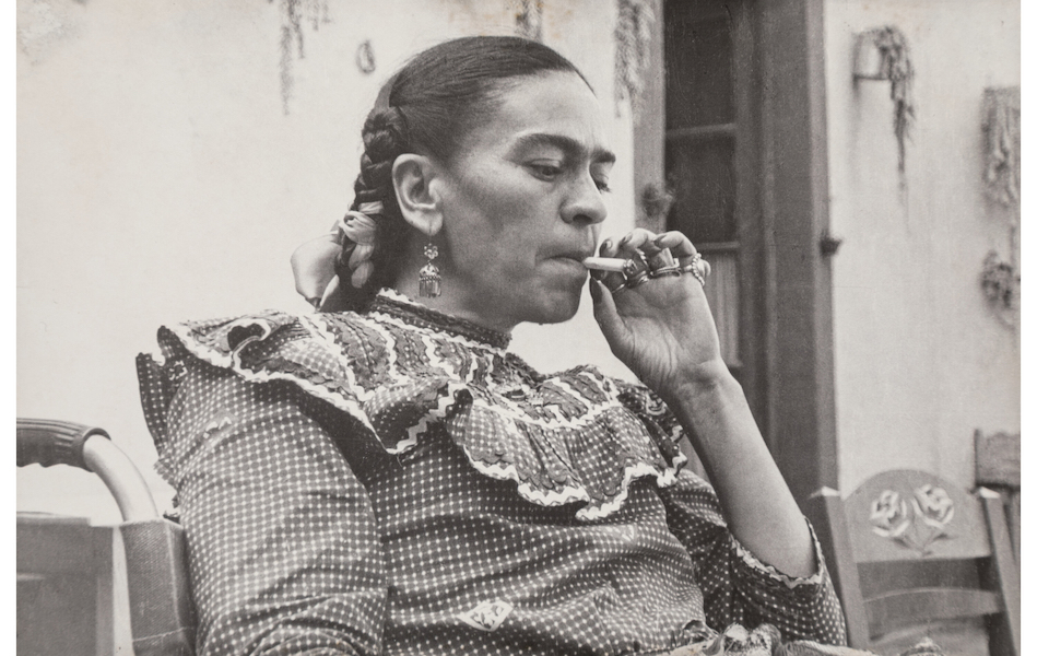 Mayo Brothers, ‘Frida Kahlo Smoking a Marijuana Cigarette in Mazahua Dress, Casa Azul, Mexico,’ estimated at $3,000-$5,000. Image courtesy of Heritage Auctions