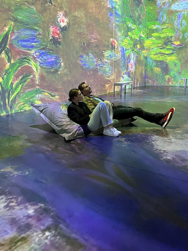  Visitors literally bask in the display created by Monet’s Garden: The Immersive Experience. Image courtesy of DKC O&M